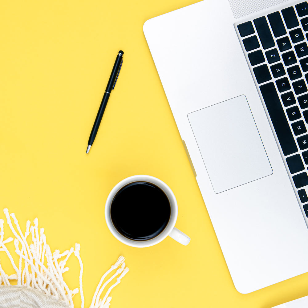 laptop-cup-coffee-plaid-yellow-background